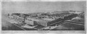 A view of the Highland Park plant of the Ford Motor Company in 1922, in: Bernard L. Johnson, "Henry Ford and His Power Farm", Farm Mechanics 102 (February 1922), http://books.google.com/books?id=hTY6AQAAMAAJ&pg=PA102#v=onepage&f=false. Via Wikimedia Commons: https://commons.wikimedia.org/wiki/File:Farm_Mechanics_1922_Ford_Highland_Park_cropped.png, public domain.