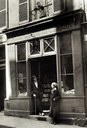 James Joyce and Sylvia Beach outside the door of Shakespeare and Company on the Rue de l'Odéon, black-and-white photograph, Paris 1920, unknown photographer; source: Poetry/Rare Books Collection, University Libraries, State University of New York at Buffalo, http://library.buffalo.edu/pl/.